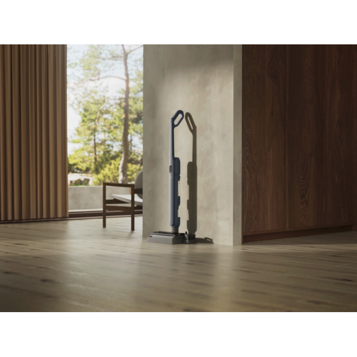 Vacuum cleaner in use in a home environment