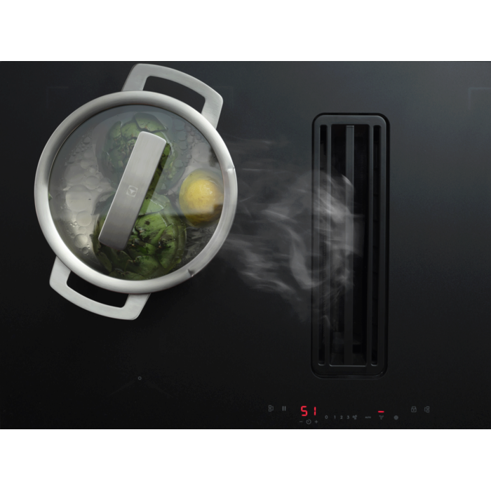 Glass lid for cooking visibility with vent for steam to exit.