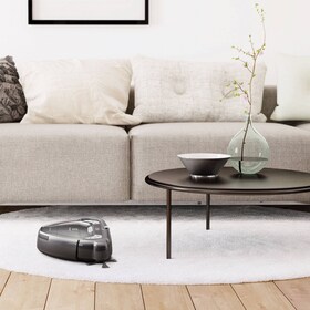 The Electrolux MotionSense™ robotic vacuum cleaning a living room