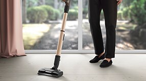 Man vacuuming carpet